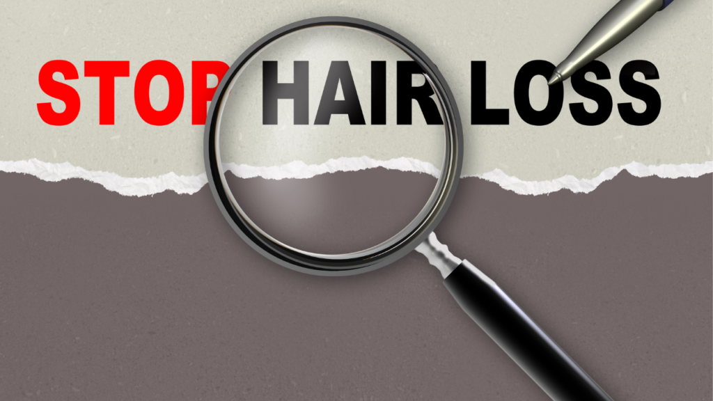 banner saying stop hair loss